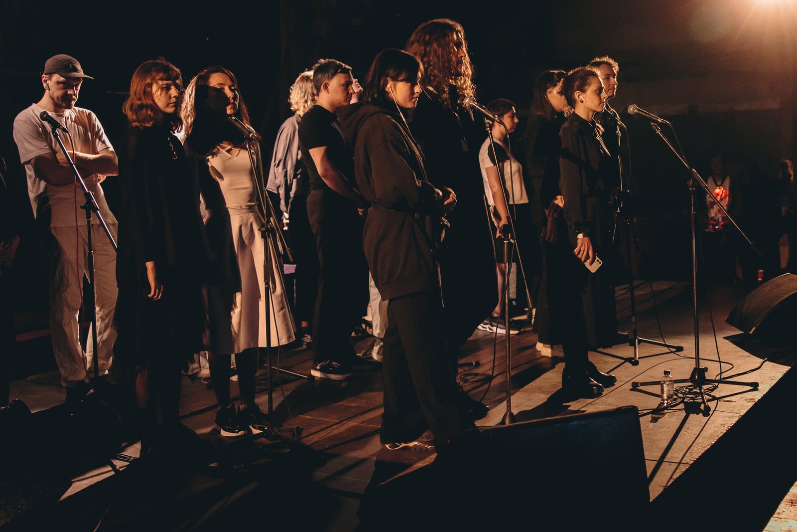 Choir on stage performing the live response to Sisters with Transistors